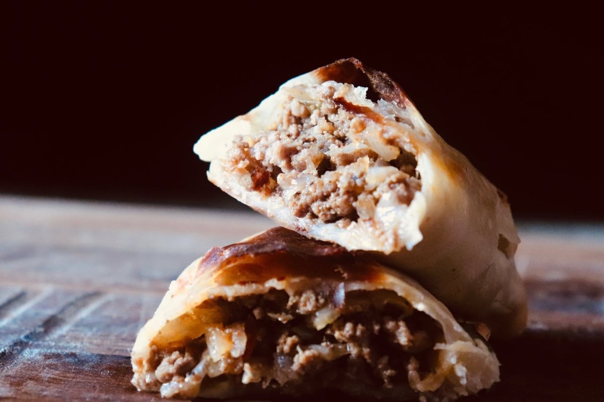 María Luisa beef empanada with its filling visible