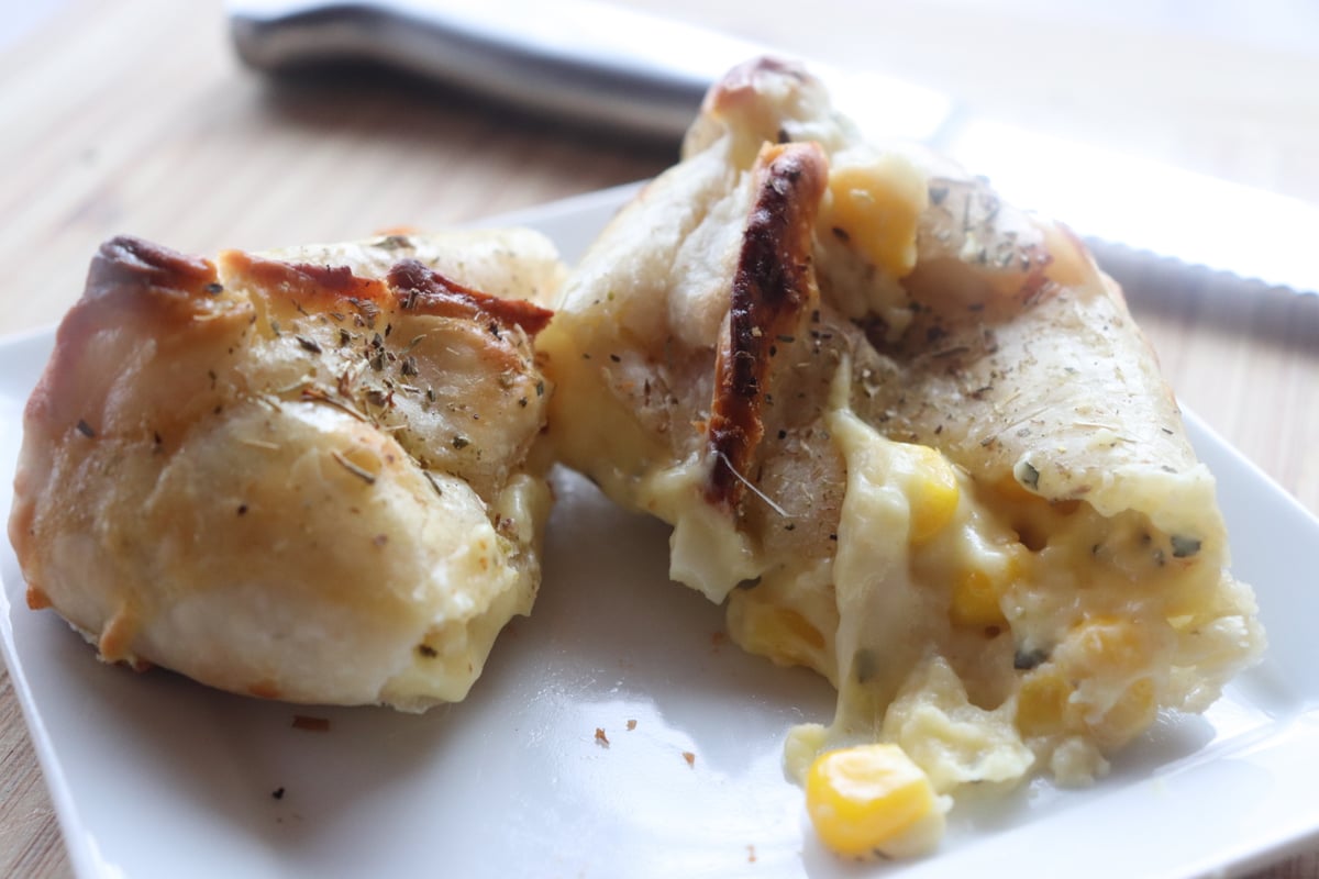 María Luisa humita empanada with its filling visible
