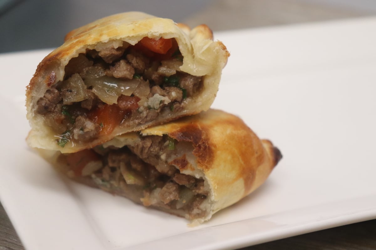 María Luisa lomo empanada with its filling visible